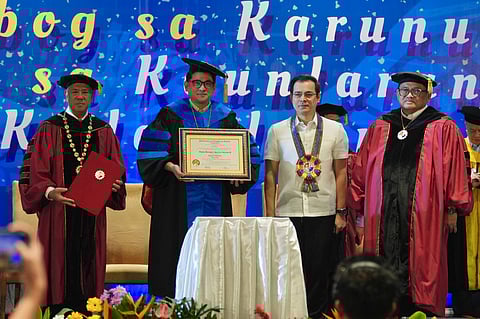 Senator Bam Aquino receives the Doctorate of Education, Honoris Causa degree from Pamantasan ng Lungsod ng Maynila (PLM) president Domingo Reyes during the PLM Graduation Ceremonies at SMX Convention Center in Pasay. Also in photo are Manila Mayor Francisco Domagoso and Atty. Edward Serapio, chair of the PLM Board of Regents.