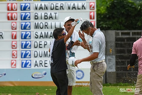 JEFFREY Lumbo celebrates with a victory douse after his epic win over Russell Bautista (left) to claim the ICTSI South Pacific crown on Friday.