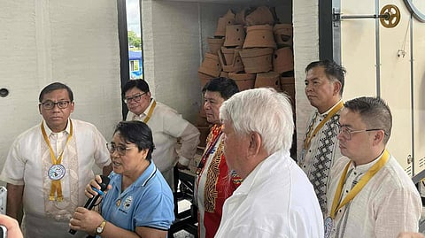 BARANGAY Pahanocoy captain Yolanda Noble (2nd from left) introduces the shuttle-type pottery kiln (back ground) during its unveiling in the village on 27 October. With her are (from left) DoST Secretary Renato Solidum Jr., DoST-6 regional director Engr. Rowen Gelonga, Negros Occidental provincial science and technology director Engr. Allan Francis Daraug, RU Foundry and Machine Shop Corporation founder Don Ramon Uy Sr., DoST Undersecretary for Regional Operations Engr. Sancho A. Mabborang, and Bacolod City Mayor Greg Gatayaba.