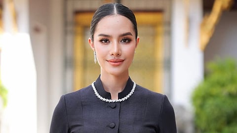 Reigning Miss World pays last respects to Thailand’s Queen Sirikit.