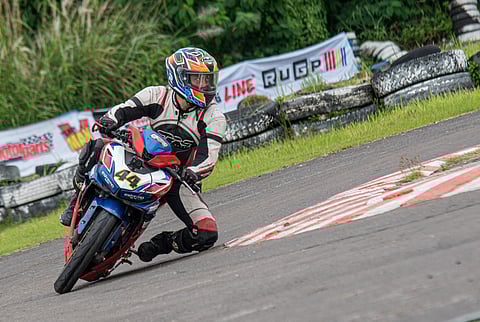 CHARGING out of the bend, Onahon shows smooth control on his way to another strong lap.