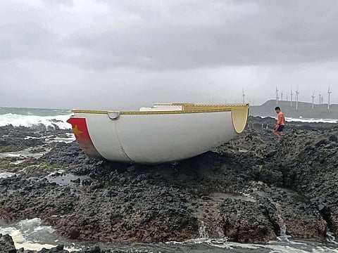 THE Philippine Coast Guard recovers rocket debris with Chinese markings along the shore of Barangay Saoit, Burgos, on Sunday.