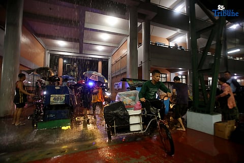 Residents living near the Marikina River arrive at H. Bautista Elementary School in Marikina City after evacuating their homes on 9 November 2025, as a preemptive measure ordered by the local government ahead of Super Typhoon Uwan.