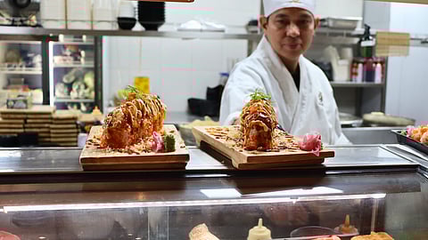 Manmaru puts its own twist on sushi with a signature roll that blends mildly spiced salmon and tuna for a fresh and flavorful bite.