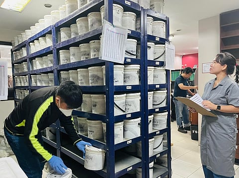 Employees of a Cement Testing Center carefully check its product to ensure that it follows global standards.