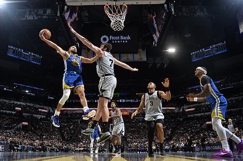 Stephen Curry scatters 49 points to lead Golden State to a 109-108 win over San Antonio in NBA action.