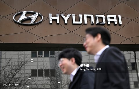 SKOREA-AUTO-INVESTMENT-ELECTRIC-HYUNDAI
Pedestrians walk past the logo of Hyundai Motor in front of a car dealership in Seoul on March 27, 2024. Hyundai on March 27, revealed plans to invest more than 50 billion USD in South Korea by 2026, with a huge chunk dedicated to boosting the development and production of electric vehicles.