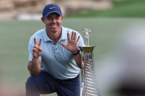 RORY McIlroy flashes the 'No. 7' sign after winning his seventh title in the season-long Race to Dubai tourney.