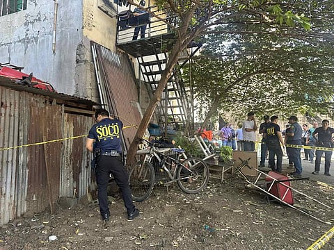 Members of the Quezon City Police District Forensic Team secure the area where Ivan Cezar Ronquillo — the partner of late freelance model Gina Lima — was found dead by hanging in a staircase balcony early Wednesday morning.