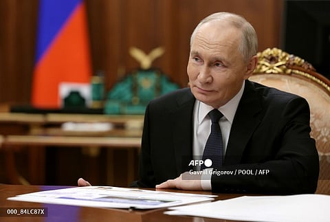 RUSSIA-POLITICS-TRANSPORT
In this pool photograph distributed by the Russian state agency Sputnik, Russia's President Vladimir Putin attends a meeting with the Russian Minister of Transport at the Kremlin in Moscow on November 20, 2025.