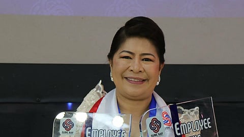Subic Bay Metropolitan Authority (SBMA) Employee of the Year 2024-Category 2, Dr. Arlene G. Cesa shows off the trophies she received at the awards ceremony held at the Subic Bay Exhibition and Convention Center on November 17, 2025. One trophy is for being the EOY of the Support Services Group, and another is for being the EOY of the SBMA.