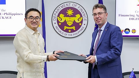 Department of Finance Secretary Frederick Go (left) formalizes with the European Union Ambassador to the Philippines Massimo Santoro the cooperation agreement between the European Union and the Philippines in launching the 22-million euro EU-Philippines Digital Economy Package.