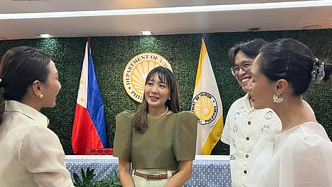 Tourism Secretary Christina Garcia Frasco (leftmost) is having a conversation with Visa Regional Head for Southeast Asia, Visa Government Solutions Bella Lai (second from left), and other Visa officials, during the signing of the Memorandum of Understanding between the Department of Tourism and global payments card, Visa, in Makati City on Thursday.
