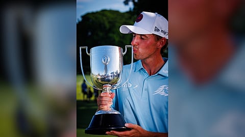 David Puig celebrates with the Joe Kirkwood Cup after winning the Australian PGA Championship at Royal Queensland Golf Club in Brisbane.