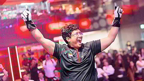 TRIUMPHANT Andika Rama raises his hands after securing his second regional championship title.