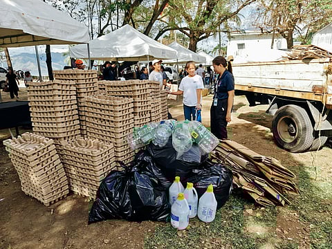 Discarded cartons and PET bottles are neatly organized during 17th Recyclables Collection Event (RCE) Opening Ceremony at the Subic Bay Mini Golf Course on November 19, 2025.