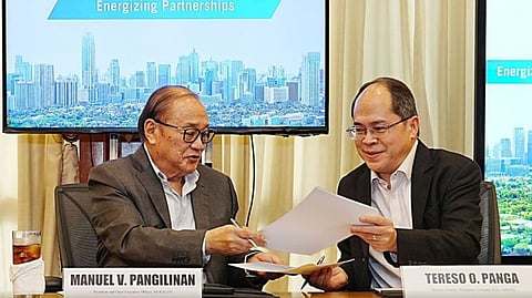 PEZA Director General Tereso O. Panga (right) and Meralco Chairman and CEO Manuel V. Pangilinan exchanges the memorandum of understanding after they affixed their signature, transpired last 3 December in Meralco headquarters in Pasig City.