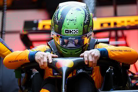 PREPARATIONS begin as Lando Norris settles into his McLaren in Las Vegas.