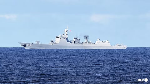 A Chinese PLA navy ship monitors an area during a maritime cooperative activity between the Philippines, Australia and Canadian navy near Scarborough Shoal in the disputed South China Sea on Sep 3, 2025. Taiwan said on Dec 5, 2025, that China had deployed warships for "military operations" stretching hundreds of kilometres from the Yellow Sea to the South China Sea.