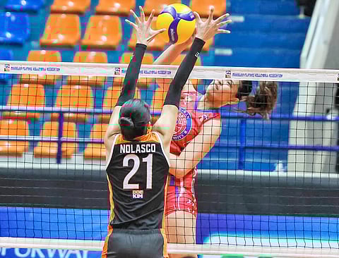 SAM Tiratira of Biñan challenges the defense of Zam Nolasco of Quezon during Game 3 of their MPVA best-of-three semifinal series late Friday at the Filoil EcoOil Centre in San Juan.