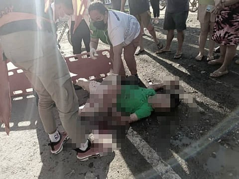 FATALLY STABBED — The body of broadcaster-councilor Gerry Campos is seen here lying on the ground after an early morning stabbing in Marihatag, Surigao del Sur, by a still-unidentified assailant. Police are still investigating the incident. Photo courtesy of Da Spotter via Gilbert Gorgonio.