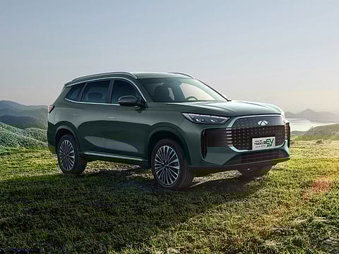 PEAK view shows the Tiggo rEV set against open hills as Chery marks a strong month in the plug-in hybrid market.