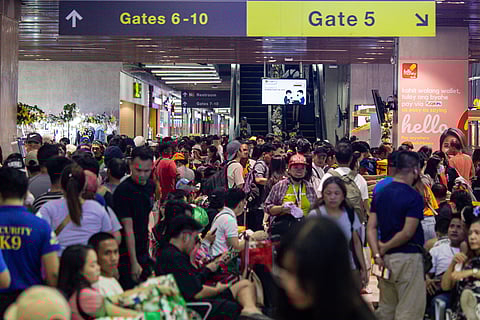 PASSENGERS continue to flock the Parañaque Integrated Terminal Exchange on Sunday ahead of the celebration of the holiday season.
