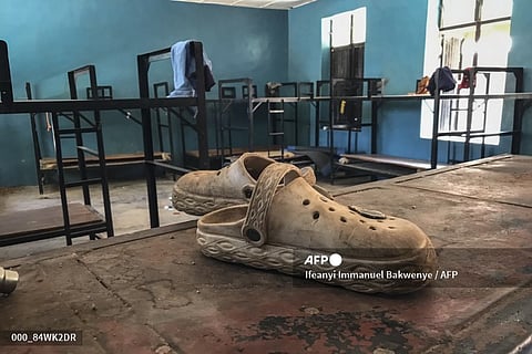NIGERIA-UNREST-KIDNAPPING-SCHOOL
A pair of shoes is seen inside a student dormitory at St. Mary’s Catholic School in Papiri, Agwarra local government, Niger state, on November 23, 2025. Fifty of the more than 300 children snatched by gunmen from a Catholic school in Nigeria have escaped their captors, a Christian group said in a statement on November 23.
"We have received some good news as fifty pupils escaped and have reunited with their parents," said the Christian Association of Nigeria in a statement, adding they escaped between November 21 and 22.
Gunmen raided early November 21 St Mary's co-education school in Niger state in western Nigeria, taking 303 children and 12 teachers in one of the largest mass kidnappings in Nigeria.
Ifeanyi Immanuel Bakwenye / AFP