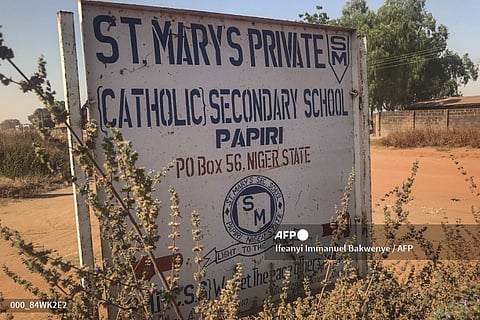 NIGERIA-UNREST-KIDNAPPING-SCHOOL
A signboard for St Mary’s Private Catholic Secondary School stands at the entrance of the school in Papiri, Agwarra local government, Niger state, on November 23, 2025. Fifty of the more than 300 children snatched by gunmen from a Catholic school in Nigeria have escaped their captors, a Christian group said in a statement on November 23.
"We have received some good news as fifty pupils escaped and have reunited with their parents," said the Christian Association of Nigeria in a statement, adding they escaped between November 21 and 22.
Gunmen raided early November 21 St Mary's co-education school in Niger state in western Nigeria, taking 303 children and 12 teachers in one of the largest mass kidnappings in Nigeria.