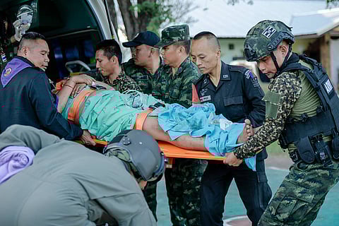 This handout picture taken on December 7, 2025 by the Royal Thai Army and obtained on December 8, 2025 shows an injured Thai soldier being evacuated following clashes along the the Thai-Cambodia border in Thailand's Sisaket province. A Thai soldier was killed and several others were wounded in fresh border clashes with Cambodia, Thailand's army said on December 8, 2025, with both sides trading blame for the latest eruption in fighting along their frontier.