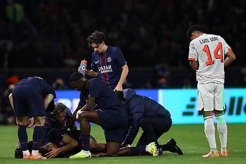 Paris Saint-Germain's Moroccan defender #02 Achraf Hakimi reacts after picking up an injury during the UEFA Champions League, league phase day 4, football match between Paris Saint-Germain (PSG) and FC Bayern Munich at the Parc des Princes in Paris, on November 4, 2025.