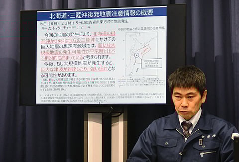 Director of Earthquake and Volcanic Engineering Affairs Division at the Japan Meteorological Agency, Satoshi Harada holds a press conference in Tokyo on December 9, 2025, after the magnitude 7.6 quake struck off Misawa on Japan's Pacific coast. At least 10 people were reported injured on December 9, but there appeared to be no major damage after a big quake
