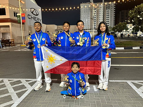 FILIPINO para swimmers Bladimir Sebastian Gonzales, Ric Daniel Pasadilla, Raemond Adefuin, Mary Hannah Diesto and Zach Lucas Obsioma (front) keep the national colors afloat in the Asian Youth Para Games in Dubai on Saturday.