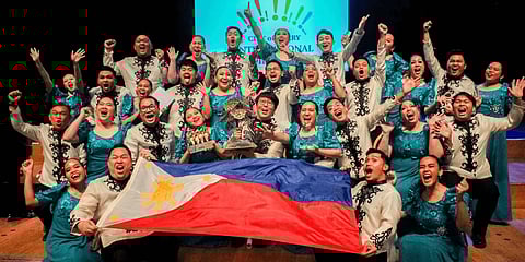 MEMBERS of the University of Santo Tomas Singers celebrate after bagging the Oak Tree of Derry Trophy at the 13th City of Derry International Choir Festival in Northern Ireland last 27 October. The victory comes during the choir’s 39th International Concert Tour across the United Kingdom.