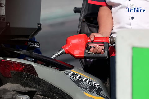 (December 16 2025) A gasoline attendant wearing a Santa Claus hat fills up vehicles of their customer at a gasoline station along EDSA in Cubao, Quezon City on Tuesday, December 16, 2025. Pump prices are set to adjust by oil companies starting Tuesday, with gasoline hike prices by P0.20 per liter, while diesel and kerosene prices will roll back by P0.20 per liter. Photo/Analy Labor