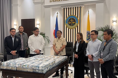 DOJ Acting Secretary Frederick Vida witnesses DPWH Engineer Gerard Opulencia’s P40 million turn-over.