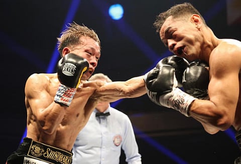 WBA defending champion Seiya Tsutsumi of Japan throws a jab against Nonito Donaire in their bout.