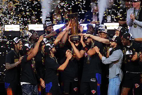 KARL-ANTHONY Towns and the New York Knicks lift the trophy after beating the San Antonio Spurs, 124-113, to rule the NBA Cup.