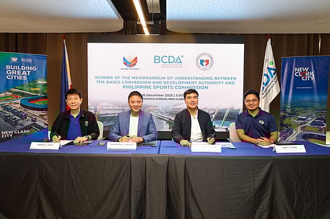 Philippine Sports Commission (PSC) Chairperson John Patrick “Pato” C. Gregorio (center-left) and Bases Conversion and Development Authority (BCDA) President and CEO Joshua M. Bingcang (center-right) signed a memorandum of understanding for sustained national training access in New Clark City in Capas, Tarlac. PSC Commissioner Edward L. Hayco (leftmost) and BCDA OIC-SVP for Conversion and Development Group Mark P. Torres (rightmost) witnessed the signing event.