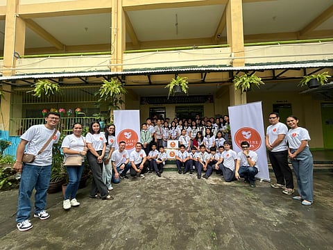 Solaire Cares volunteers and one of the school beneficiaries Don Galo Elementary School in
Parañaque City