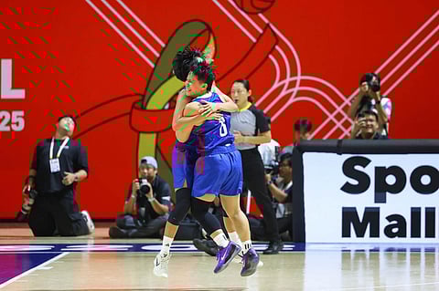 CHACK Cabinbin hugs Janine Pontejos after powering Gilas Pilipinas to a 73-70 win over Thailand in the gold-medal match of the 33rd Southeast Asian Games women’s basketball event on Friday.