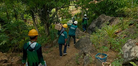 ACCREDITED electricians install electrical systems in indigent households in Naga City and San Fernando to provide safe access to electricity under the DOE ER 1-94 program.