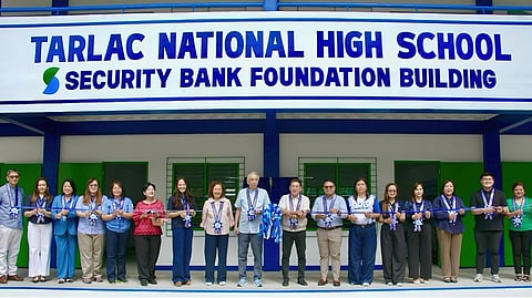 TURNOVER ceremony of the two-story classroom building at Tarlac National High School, led by Security Bank Foundation chairman Rafael Simpao Jr. and Jesus V. del Rosario Foundation executive director Kana Manglapus.