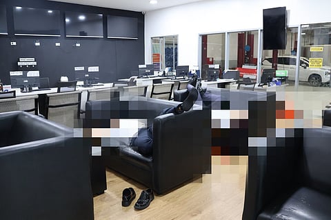 THE remains of the slain security guards inside a car dealership in Quezon City are secured by authorities after they were discovered on Christmas Eve. Police said that the victims were on duty and were reportedly asleep on a couch inside the service lounge area when the suspect, also a security guard, allegedly carried out the attack.