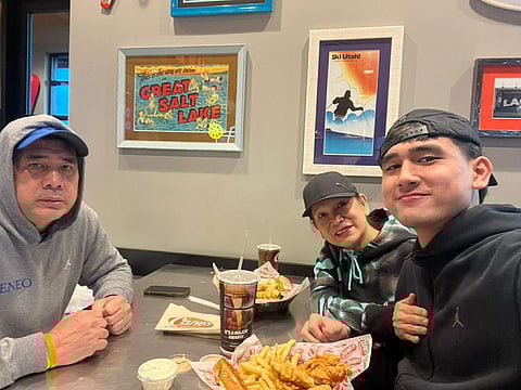LOUIE Alas (left) and wife Liza (middle) are spending Christmas away from their three other children as they support their youngest son, Kieffer, in his basketball journey.