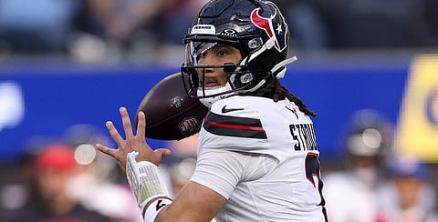 C.J. Stroud delivers a touchdown pass that lifted the Houston Texans to a 20-16 win over the Los Angeles Chargers to reach the National Football League playoffs on Saturday.