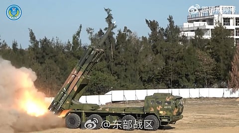 This frame grab from China's People's Liberation Army (PLA) Eastern Theater Command undated handout video footage released on December 30, 2025 via AFPTV shows a Chinese rocket launcher firing rockets in an undisclosed location. China kicked off a second day of live-fire drills around Taiwan on December 30, aimed at simulating a blockade of the self-ruled island's key ports and assaults on maritime targets.