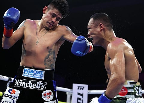 CHARLY Suarez (right) takes a beating not from Mexican WBO titleholder Emanuel Navarrete but from an officiating error during their title fight last year in San Diego, California.