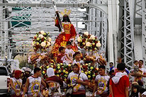 Catholic devotees start lining up with their replica of Jesus Nazareno along designated streets in Quiapo, Manila, on the morning of 03 January 2025. The blessing of the replica, which will take place in the afternoon, is expected to draw thousands of devotees.