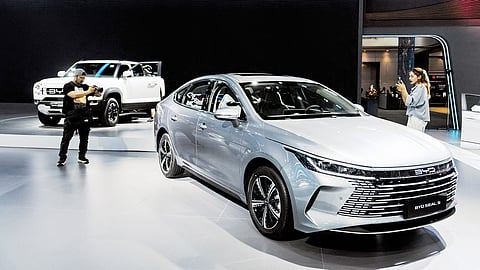 VISITORS examine a BYD electric performance car on display as the Chinese automaker strengthens its global presence.